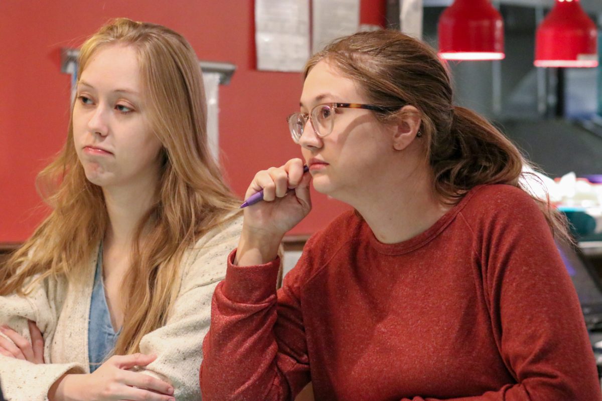 Alyssa and Bri Pfeifer both mull over their latest topic. They were on a team with four other people.