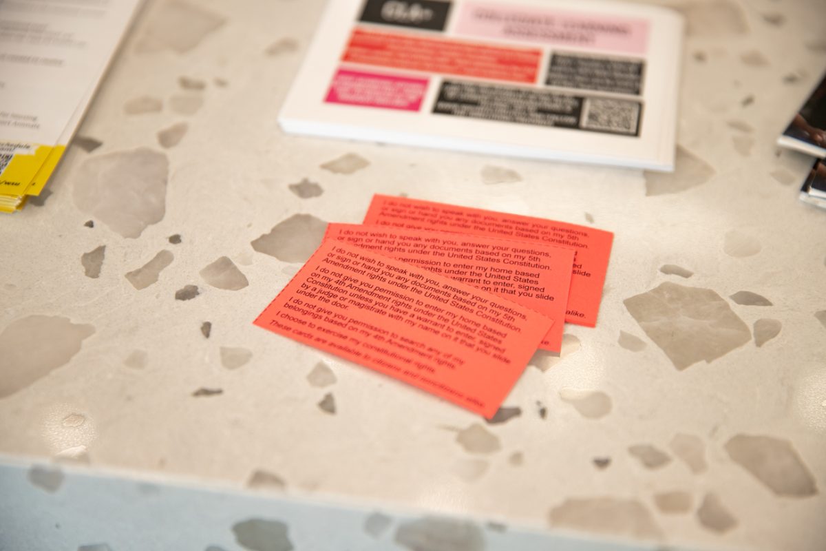 Red papers in the Shocker Success Center and other campus locations outline how people should interact with ICE agents.