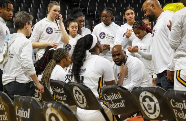 Women's basketball head coach Terry Nooner talks with his team before the game starts on Feb. 15. The Shockers won, 60-57, against the Rice Owls.