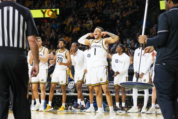 Senior guard Xavier Bell flexes during Wichita State's win against Tulane. The Shockers have won six straight games against AAC opponents.