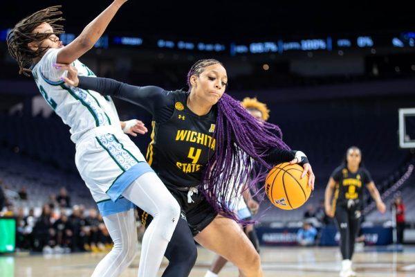 Jayla Murray pushes a Tulane defensive player in the first quarter. Murray scored 10 points for the Shockers on March 9.