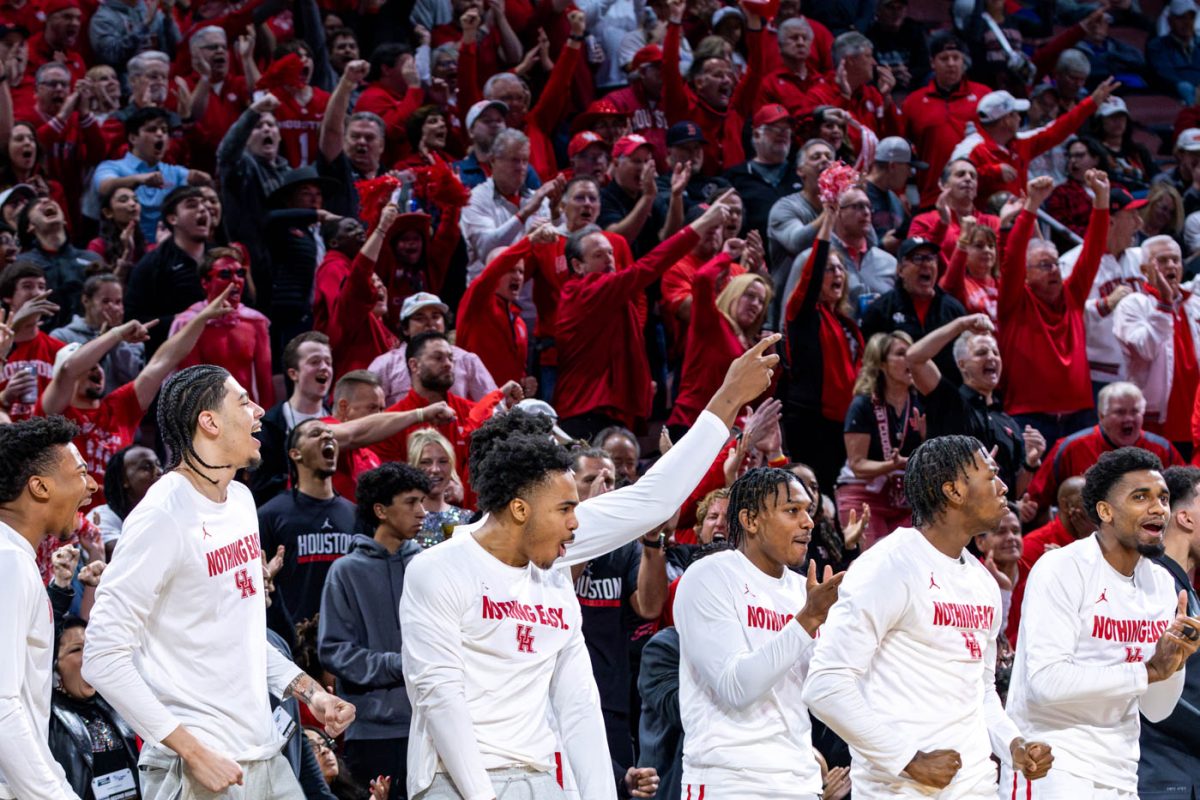 Houston players and fans celebrate after a 3-point shot early in the game against Gonzaga. Houston won, 81-76.