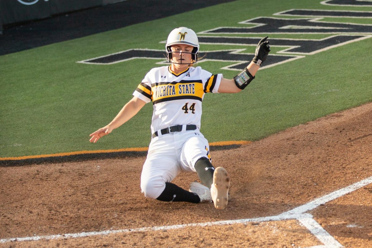 Senior Camryn Compton slides into home plate during the game against South Florida on March 28. WSU won, 9-4, over the Bulls.