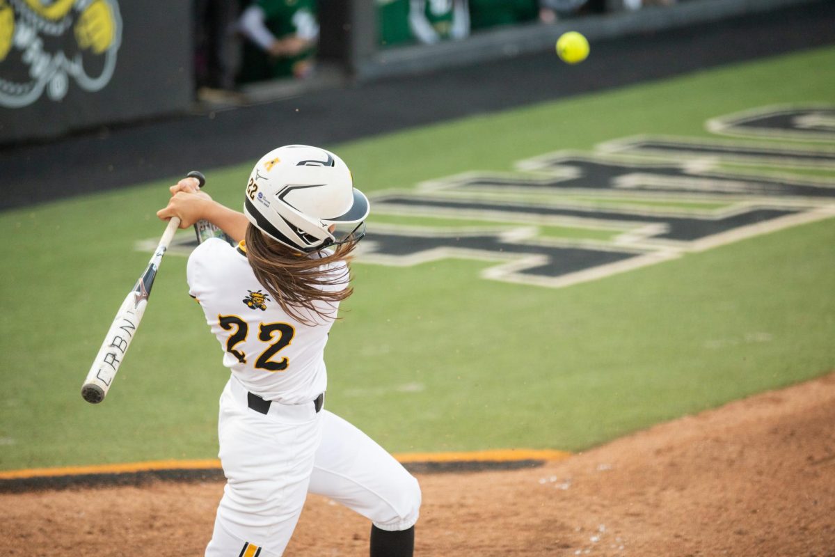 Junior Jodie Epperson hits a foul ball during a game against South Florida on March 28. The Shockers won, 9-4.