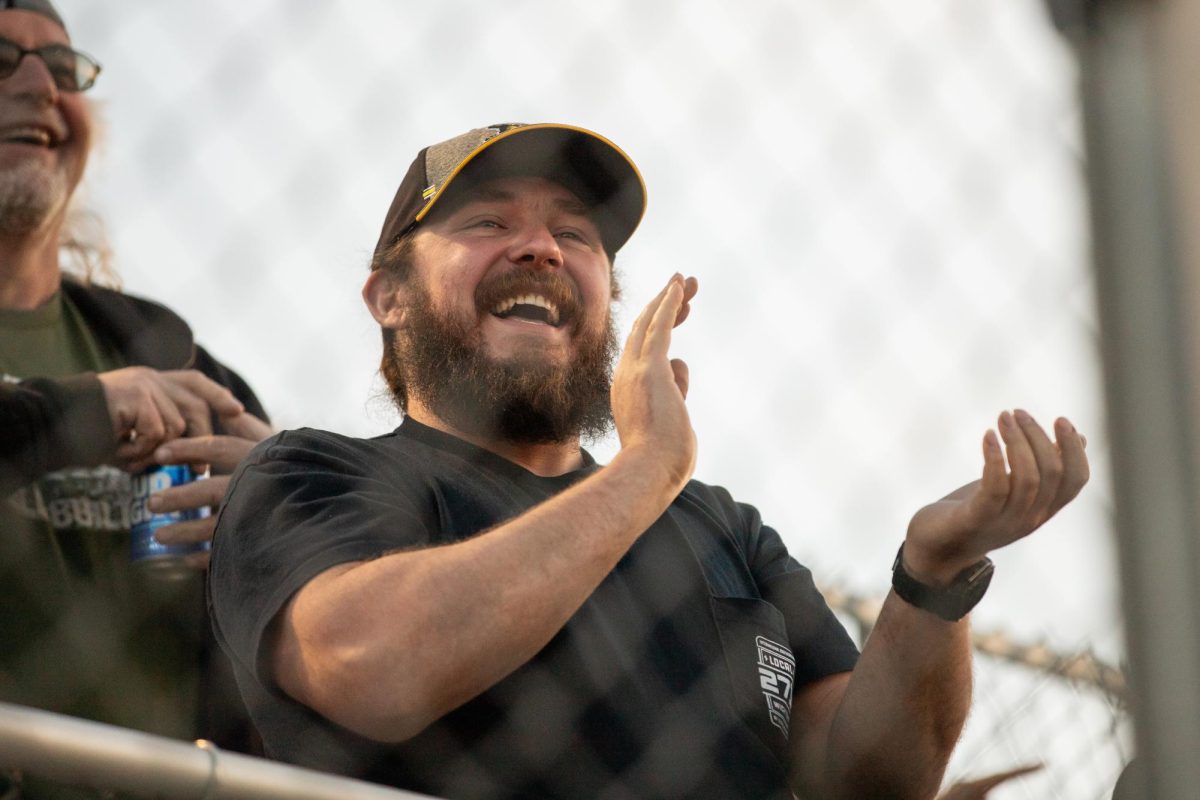 A Wichita State fan cheers during the game against South Florida on March 28. The Shockers won. 9-4, during the first game in a three-game series.