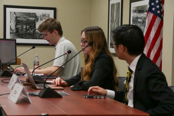 Clerk of the Senate Noah Carter, speaker of the senate Victoria Owens and president of the senate Matthew Phan run Wednesday's SGA meeting.