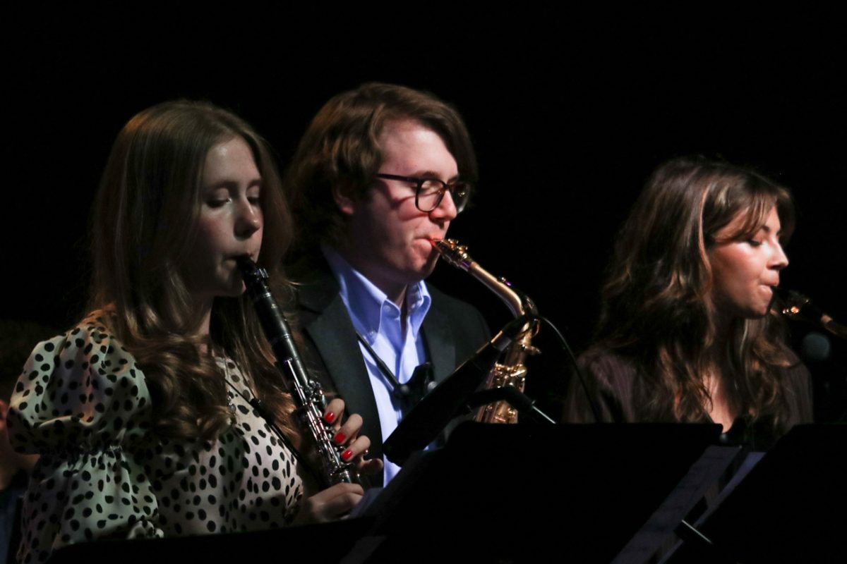 Saxophonic members Madeline Natvig, Nathaniel Thompkins, and Zoey Isom perform at Walker's Jazz Lounge. The Saxophonics were the first group to perform for the night.