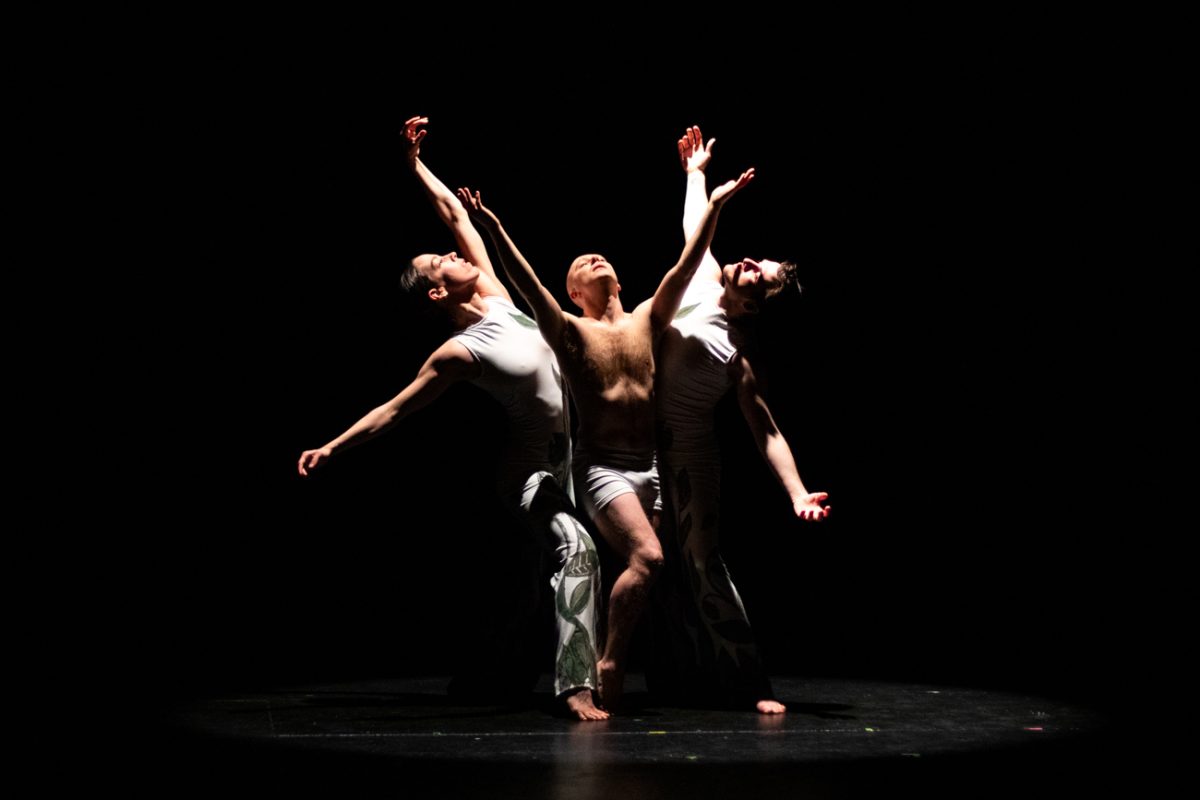 Rhiannon Vieyra, Gavin Gonzalez-Meyers, and Daniel Gonzalez-Meyers spread their arms on stage while performing "Lifesong." The performance was held in the CAC Theater on March 1 at 7:30 p.m.