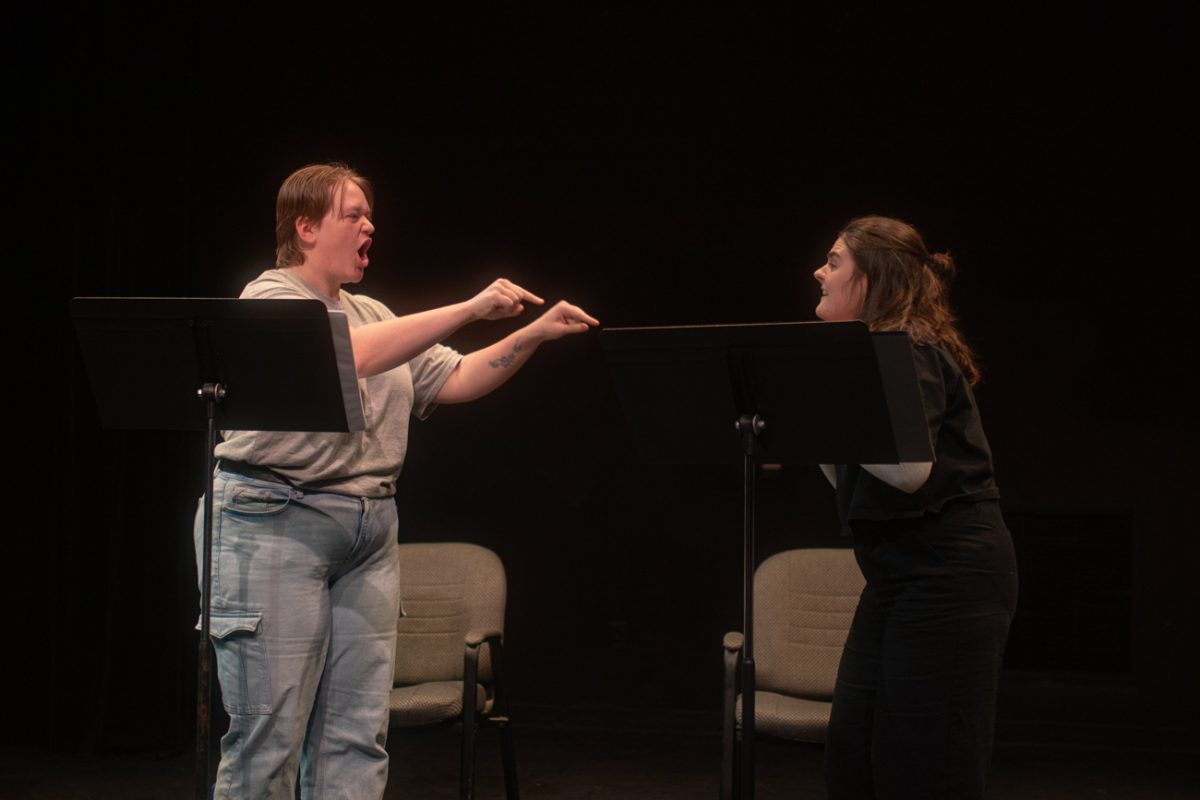 Senior Morgan Holcomb yells at Stevie Longacre while performing "The Angel of Death" on March 6. Holcomb's character was the mother on Longacre's character in the show.