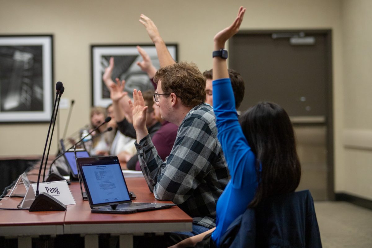 Senators vote on legislation at Tuesday nights meeting. This was an emergency meeting regarding a $900,000 deficit in student fees to fund services and organizations.