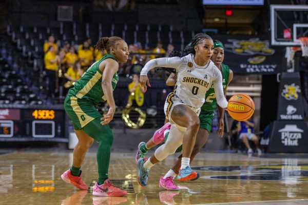 Taylor Jameson runs with ball against Charlotte on March 1. The game ended with the score of 62-43, a Wichita State win.