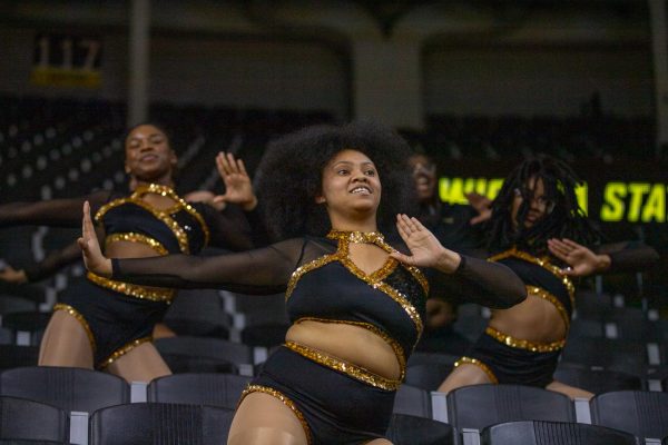 WSU majorette dancers perform a choreographed dance during the women's basketball game on March 4. The team attends various basketball games at the Charles Koch arena.