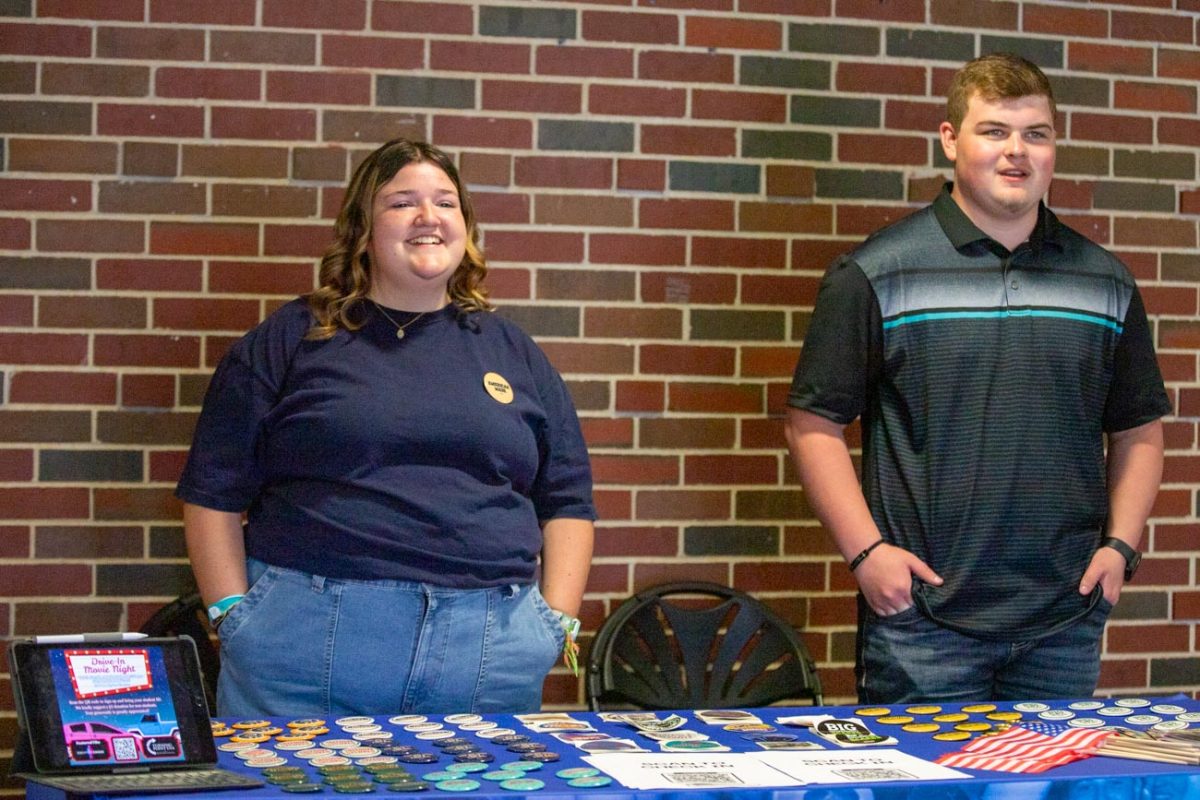 Savanna Sparrow and William Crawford table at the event with guest speaker Olivia Krolczyk. 