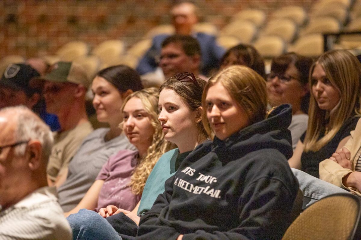 Attendees at the Turning Point USA event at Wichita State listen to Olivia Krolczyk speak. Krolczyk is an ambassador for the Riley Gaines Center and opposes trans women participating in women's sports.