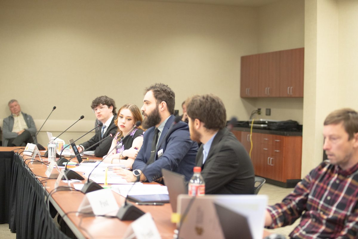 Sen. Andrew Bobbitt , a member of the Student Fees Commission, speaks at the commission's first hearing to decide student fee allocations. After the committee learned of a shortfall in funding, the hearing was rescheduled for Wednesday, March 3. 