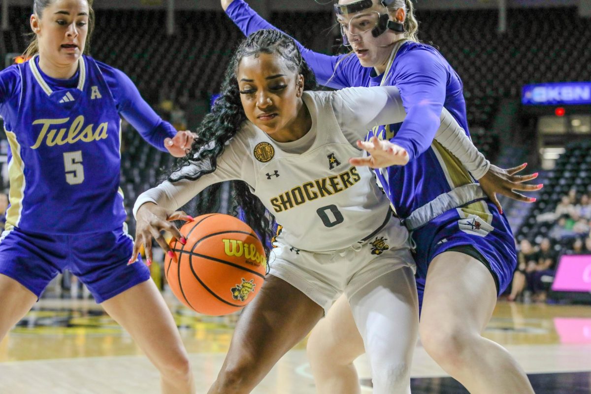 Graduate student guard Taylor Jameson drives the ball in the first quarter of the March 5 game. Jameson contributed eight points to Tuesday's game against Tulsa.