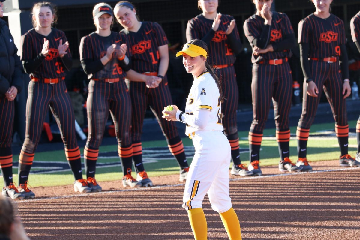 Junior Jodie Epperson receives a ball before Wichita State's game against Oklahoma State University. Epperson didn’t hit a home run in her two seasons at the University of North Texas, but smacked one in her first game as a Shocker.