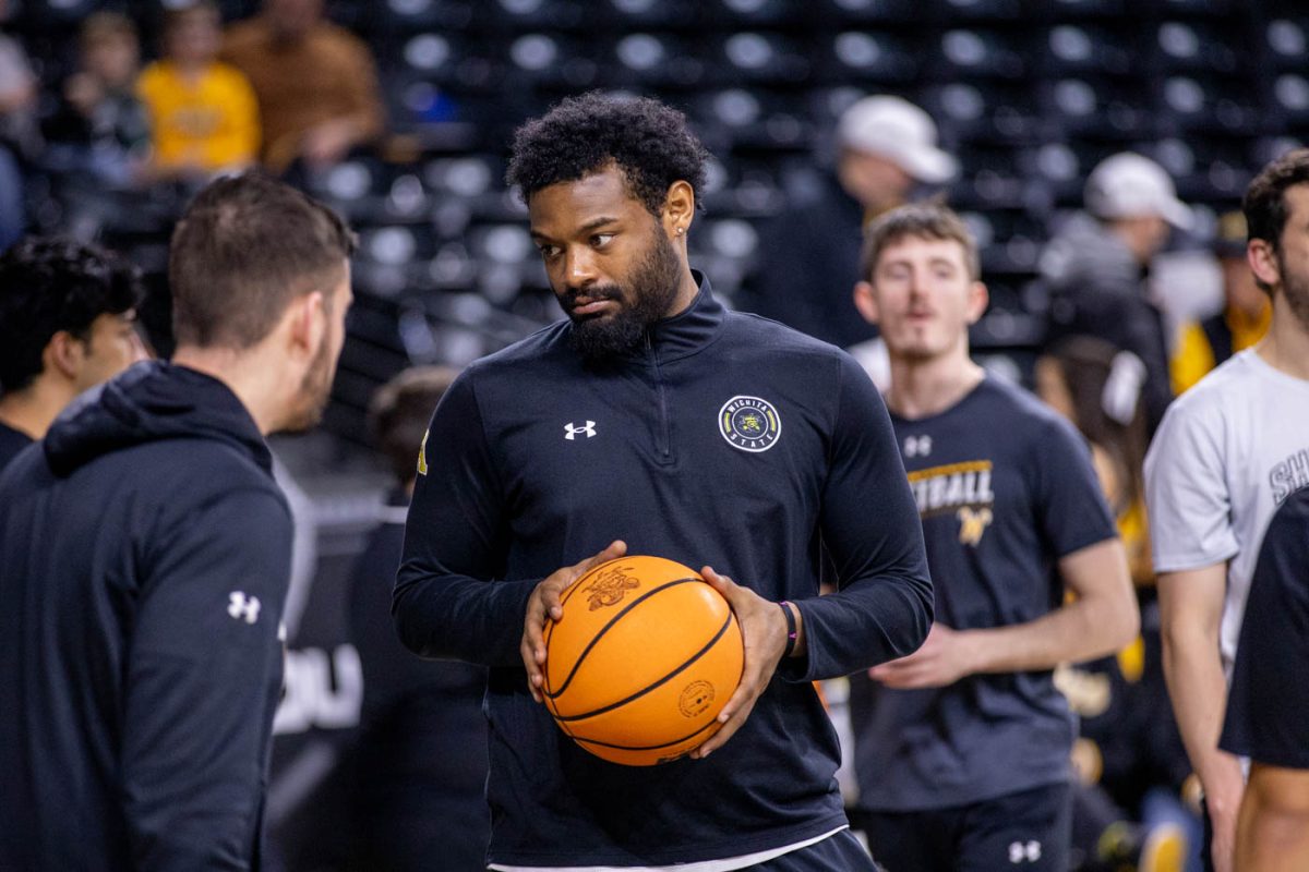 Isaiah Hubbard, a Wichita State basketball manager, talks before a game. Hubbard, who hails from Chicago, is a member of Phi Beta Sigma Fraternity.