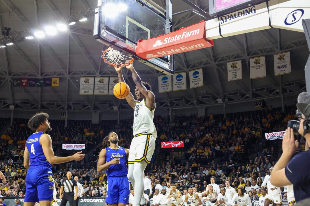 Senior center Quincy Ballard throws down a dunk on March 9. Ballard shot 2-5 from the field in the WSU loss.