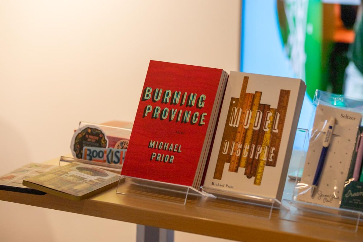 Books by Michael Prior, "Burning Province" and "Model Disciple" were sold at the poetry event by Prior. The books have won multiple awards.