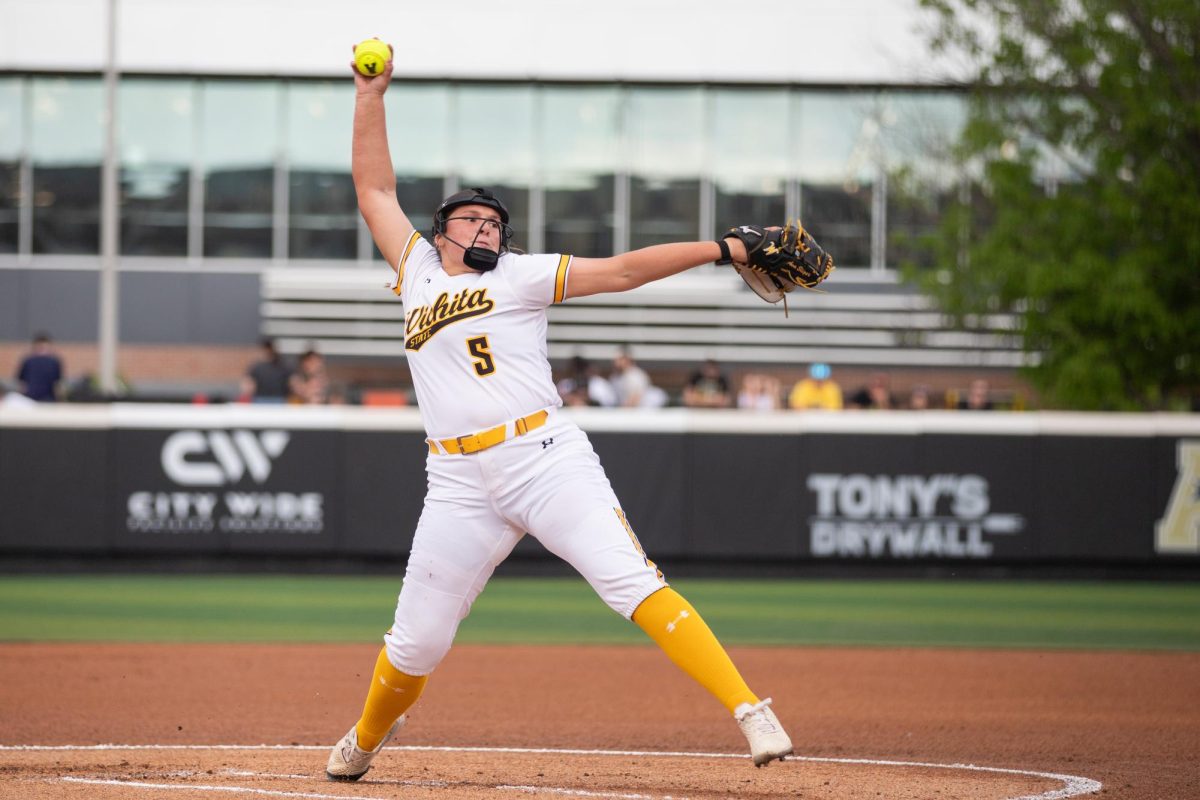 Freshman Ava Sliger prepares to pitch the ball during a game against the University of Kansas. The Shockers pulled up short of the Jayhawks, 5-3.