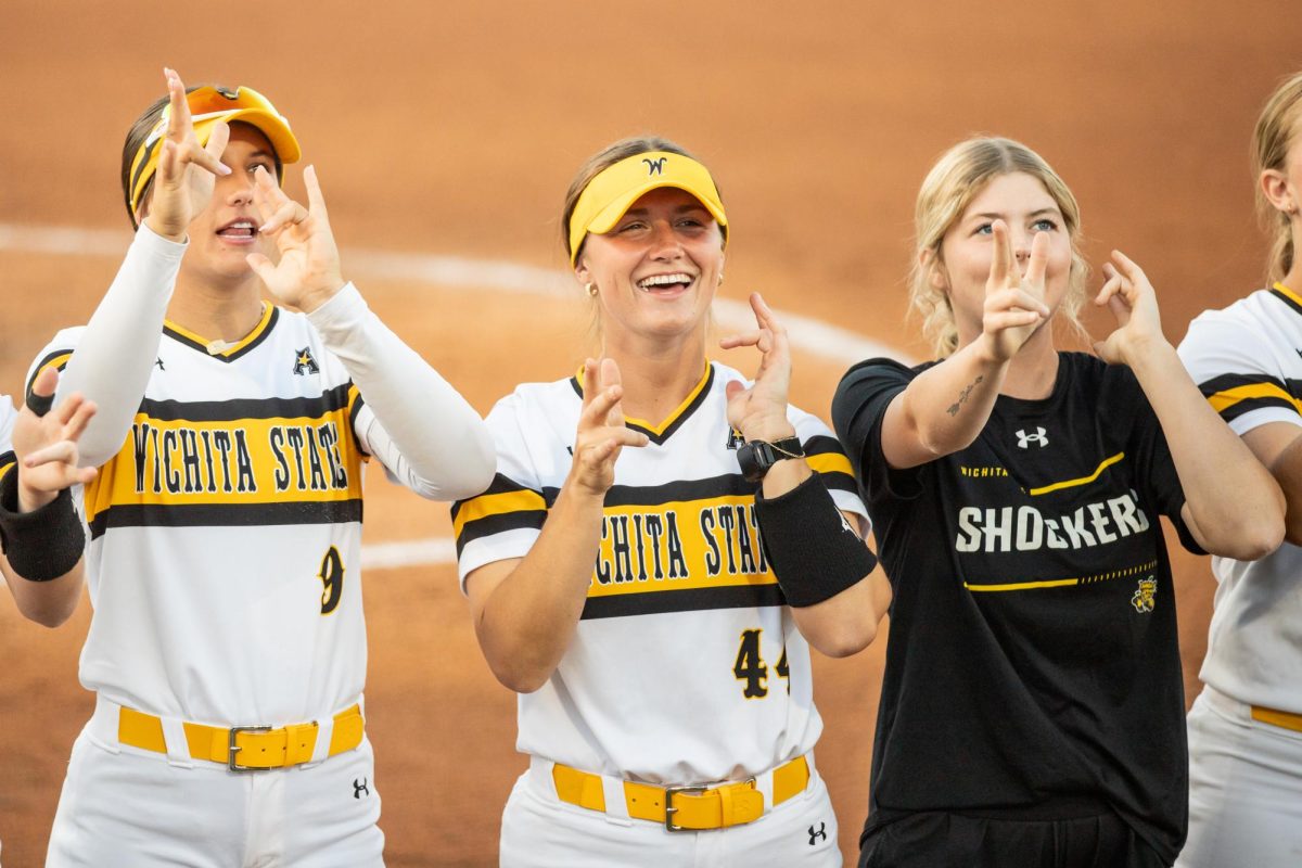 Wichita State players make the Shockers hand sign on April 11. The 11-2 win in the series opener was the Shockers' 11th-straight over East Carolina.