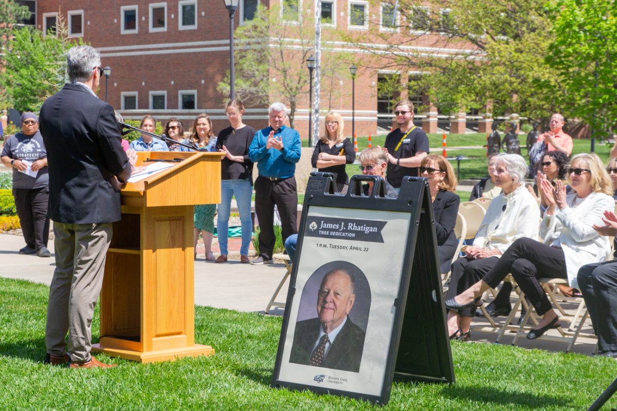President Richard Muma addresses the attendees of the James J. Rhatigan Tree Dedication ceremony on Tuesday, April 22. The canaert juniper and a plaque in Rhatigan's memory were unveiled by Rhatigan's wife, Beverly, his daugher, Becky, and his son-in-law, Joe.