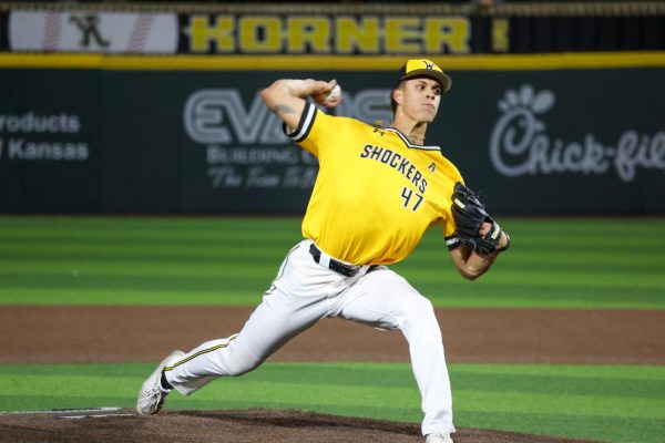 Junior Nick Potter winds up throw a pitch on April 2. Potter got two outs against Kansas State, walked three batters and gave up a run.