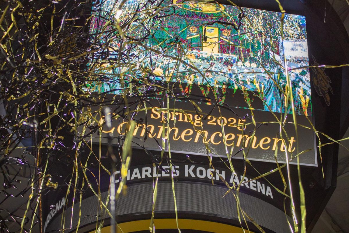 Confetti blasts as the spring commencement comes to its end.