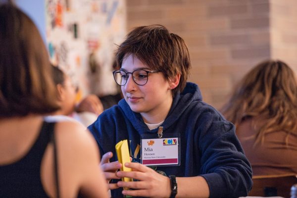 During the 2024 Kansas Collegiate Media conference, former Sunflower Editor-in-Chief Mia Hennen works with students from other student publications in Kansas during a trivia game. 