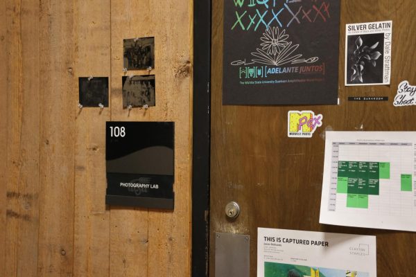 The door to McKnight's darkroom as a student uses the lab to process their photos on Thursday, May 1.