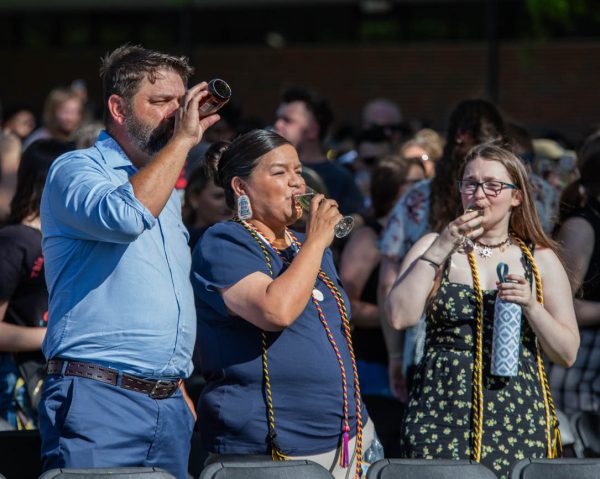 Members of the crowd sip their drinks after toasting for the class of 2025. The Toast ceremony started in 2018 and invites graduates to celebrate their accomplisments in an less formal scenario than commencement.