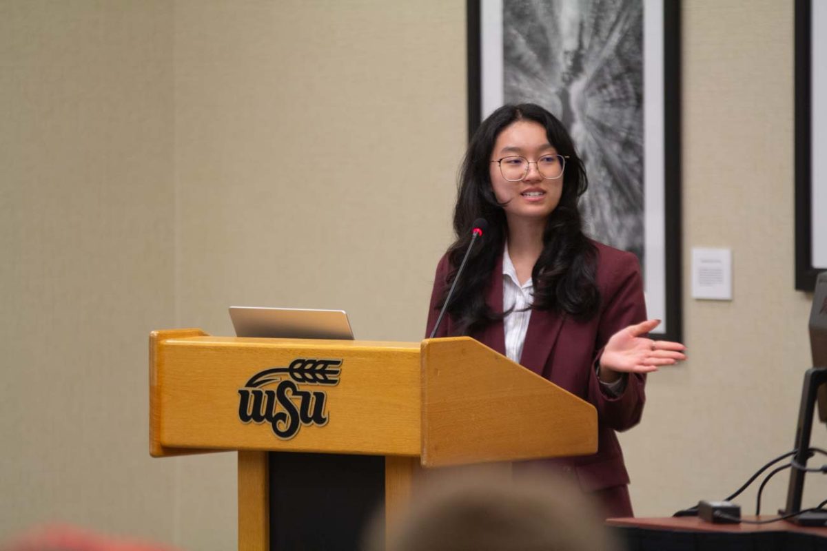 Student Body President Jia Wen Wang addresses the SGA senate in the first meeting of the 68th Session. The April 30 meeting was Wang's very first as acting student body president.
