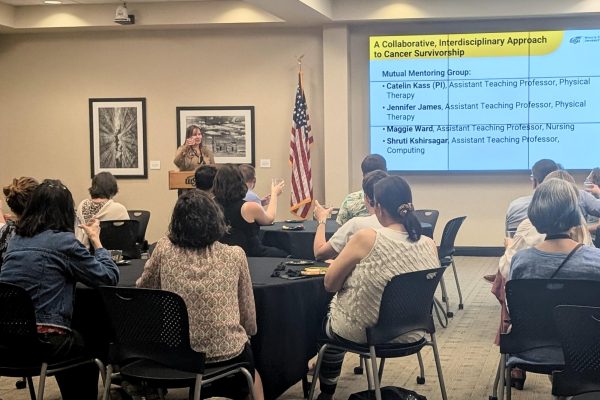 Faculty raise their glasses in a toast to the research projects presented at an event hosted by the office of Faculty Advancement, Retention and Excellence. Despite uncertain funding after a federal grant was cut, the teams said they plan to continue with alternative funding if possible. 