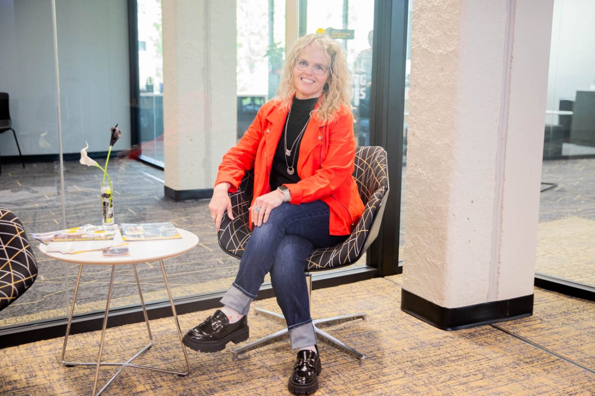 Social work student Robin Monroe poses for a photo in the Online and Adult Learners office. Monroe said that OAL helped her throughout her time at WSU. 