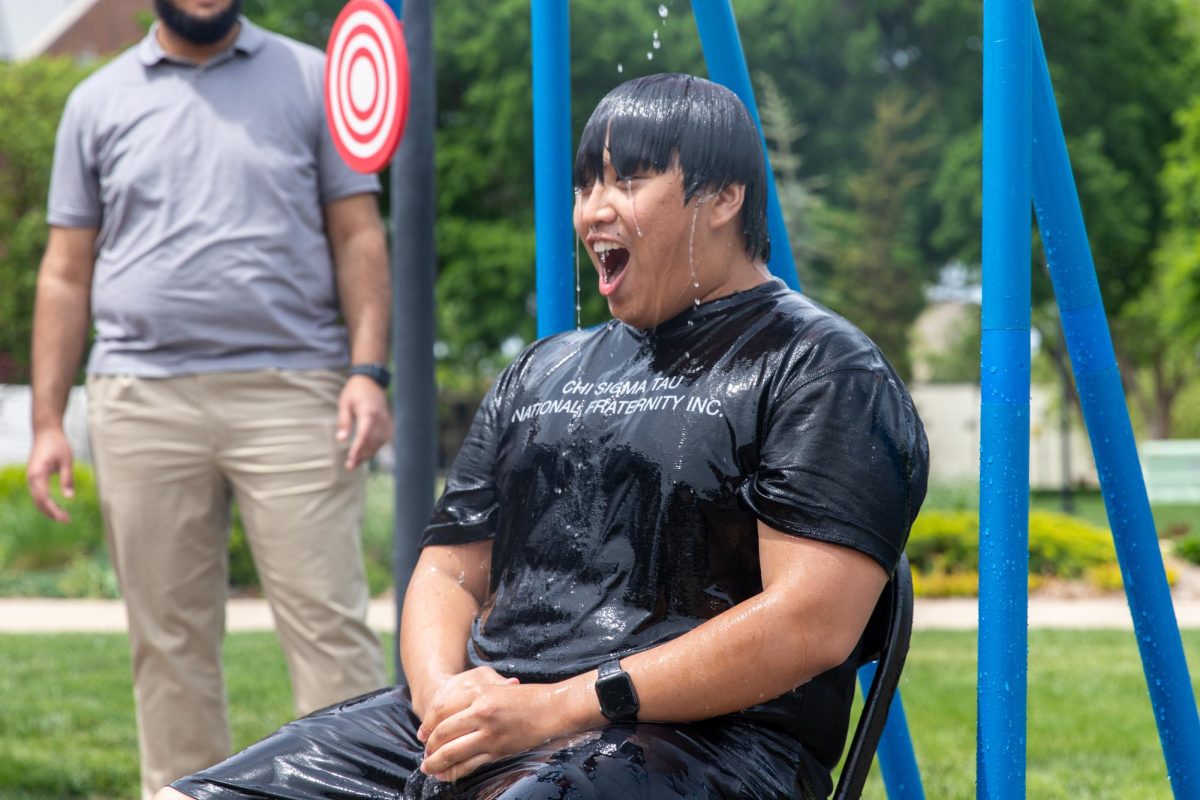 Nicholas Le gasps for air after being dunked in water at the Asian Student Conference fundraiser on April 29. Le was dunked several times during the end-of-the-semester event.