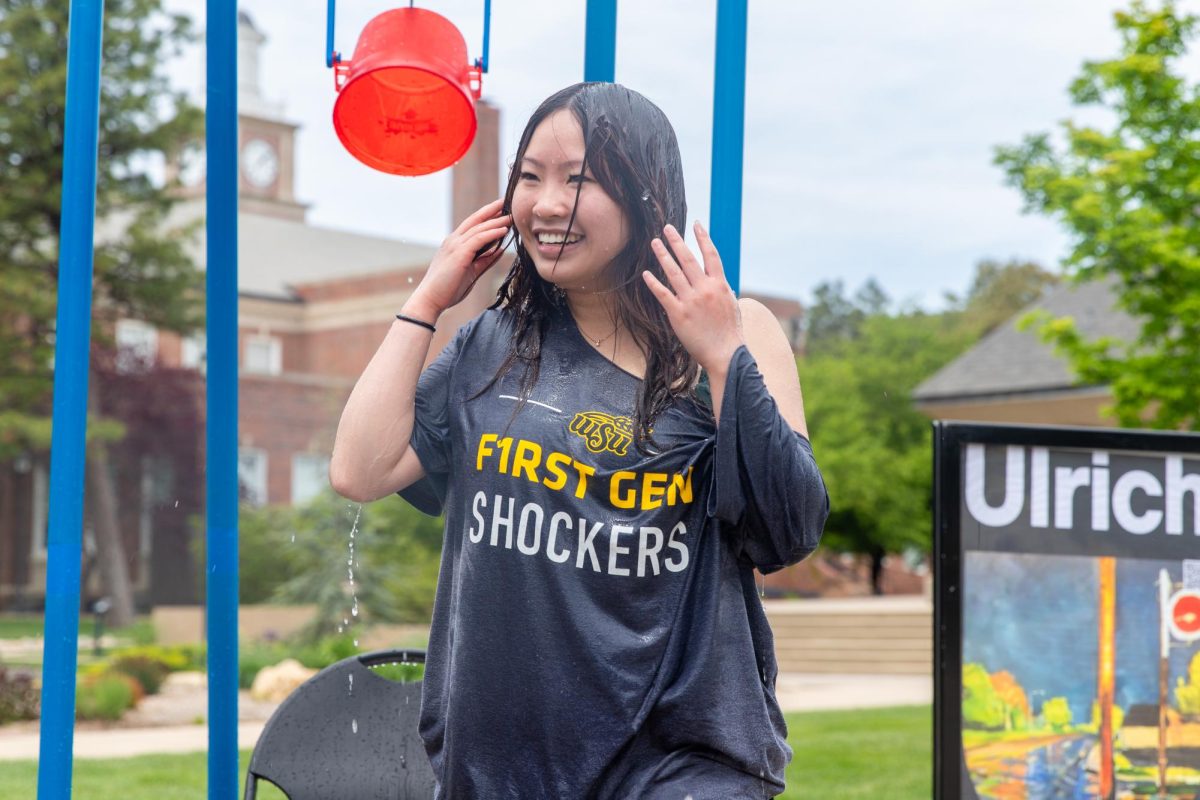 Lynn Tran, a second year health science student, brushes her hair out of her face after being dunked at the ASC fundraiser outside the RSC.