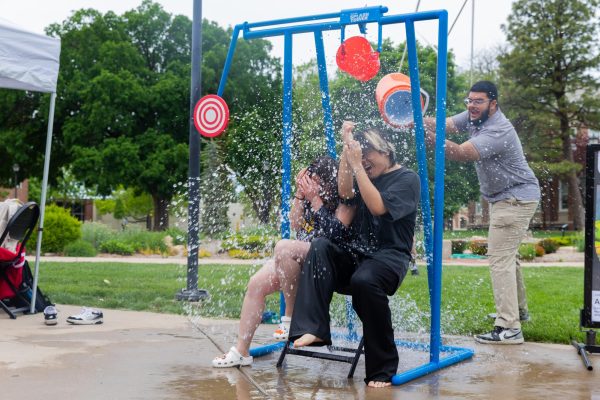 Lynn Tran and Cardin Nguyen brace themselves as they have a cooler of water dumped on their heads. The pair were the last to be dunked at the ASC fundraising event.