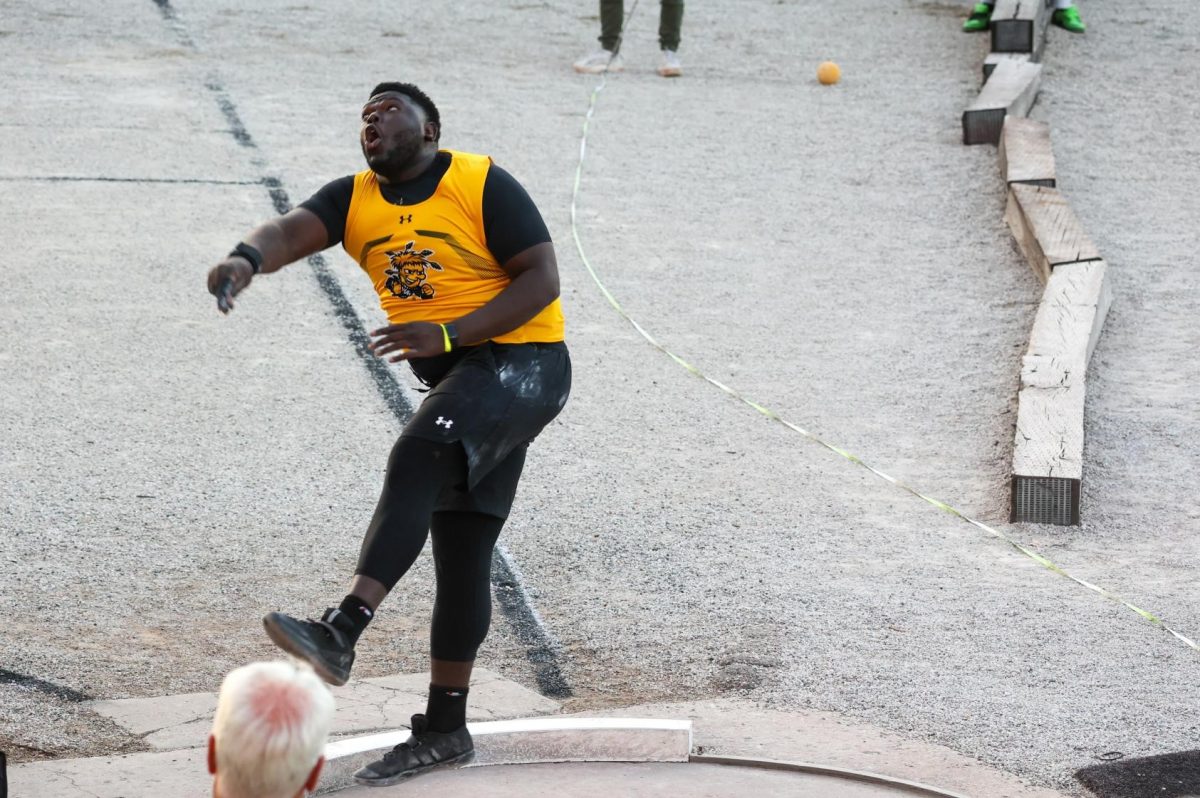Senior Athan Huelskamp spins after throwing the shot put on April 11. Huelskamp placed highest for WSU in the men's shot put during the KT Woodman Classic with a fourth-place finish.