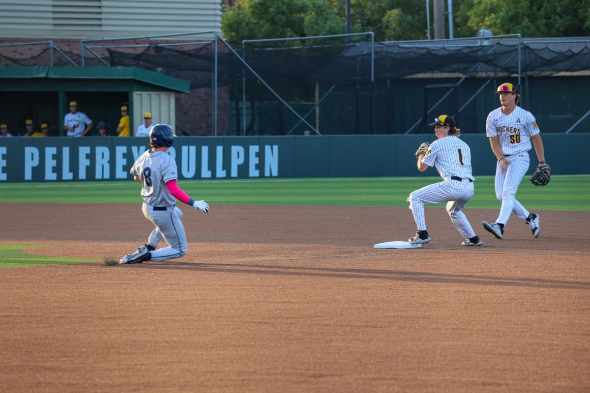 Sophomore Zeb Henry tags second base for a force out and goes to throw the ball to first on May 13. Henry made a putout and assist in the 13-9 win over Oral Roberts.