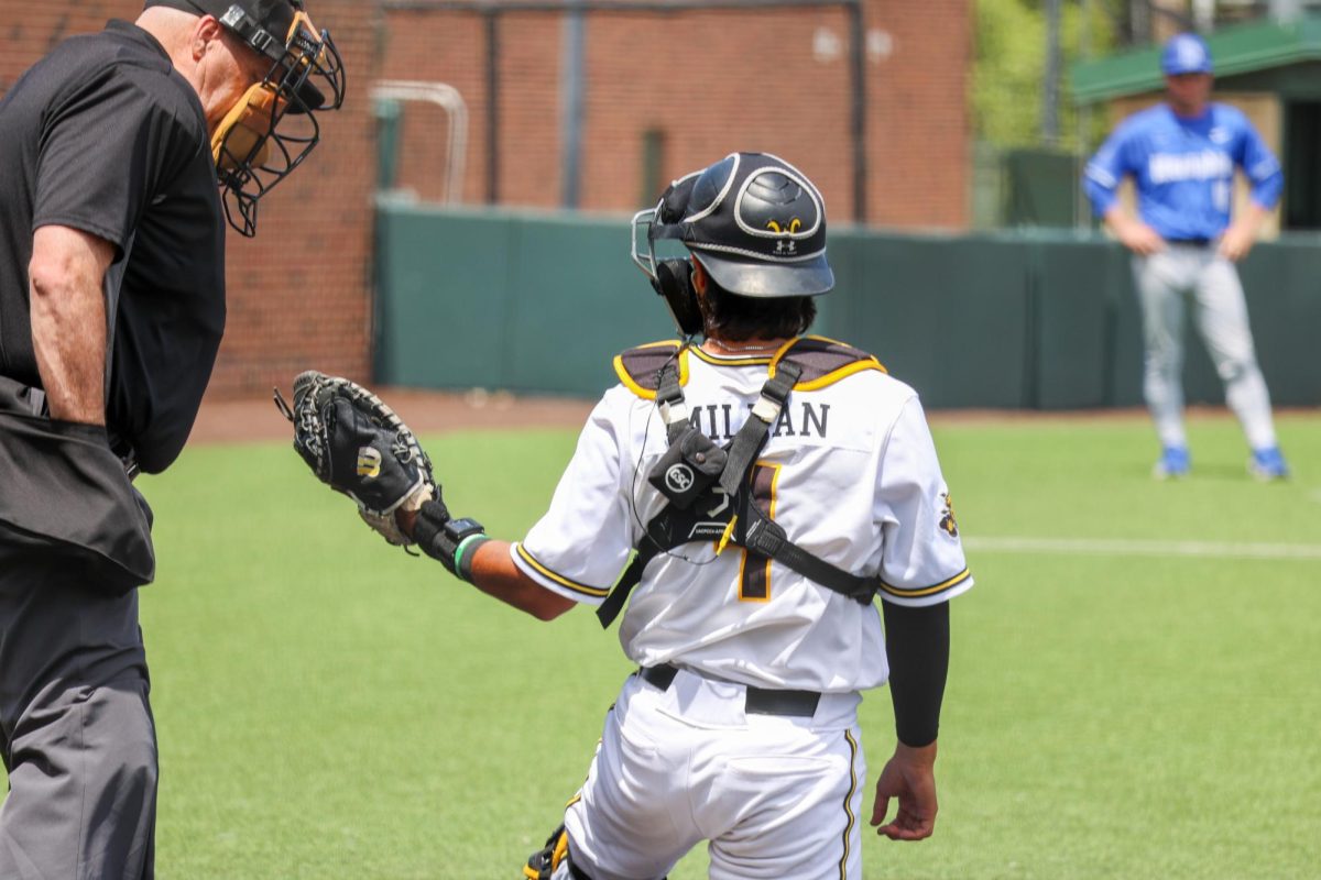 Senior Mauricio Millan asks the home plate umpire for a ball on May 17. Millan made 10 put outs for the Shockers in a 3-1 win against Memphis.