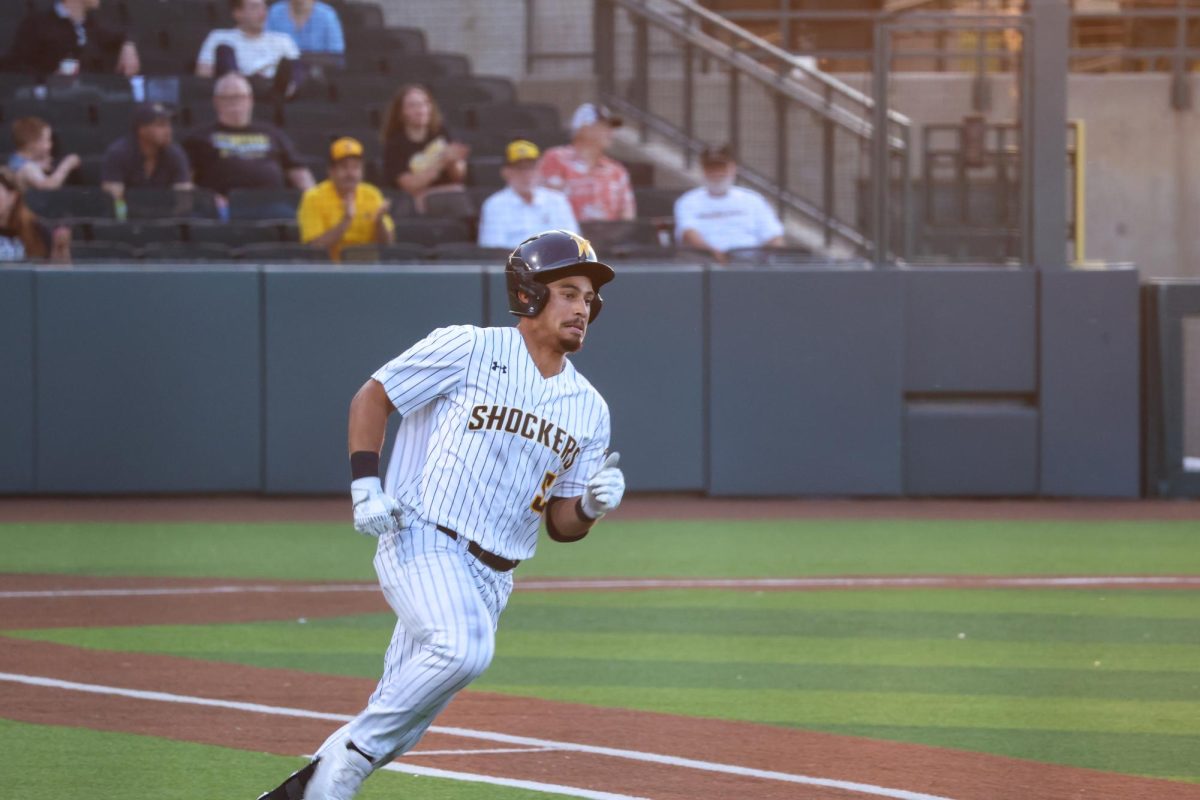 Sophomore Kaleb Duncan runs to first base after hitting a ball on May 13. Duncan had two hits in the 13-9 win against Oral Roberts.