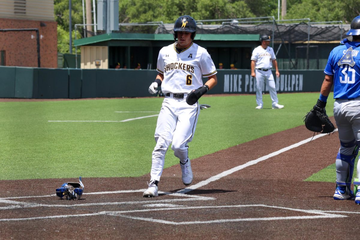 Sophomore Camden Johnson crosses home plate on May 17. Johnson scored two runs for the Shockers in a 3-1 win against Memphis.