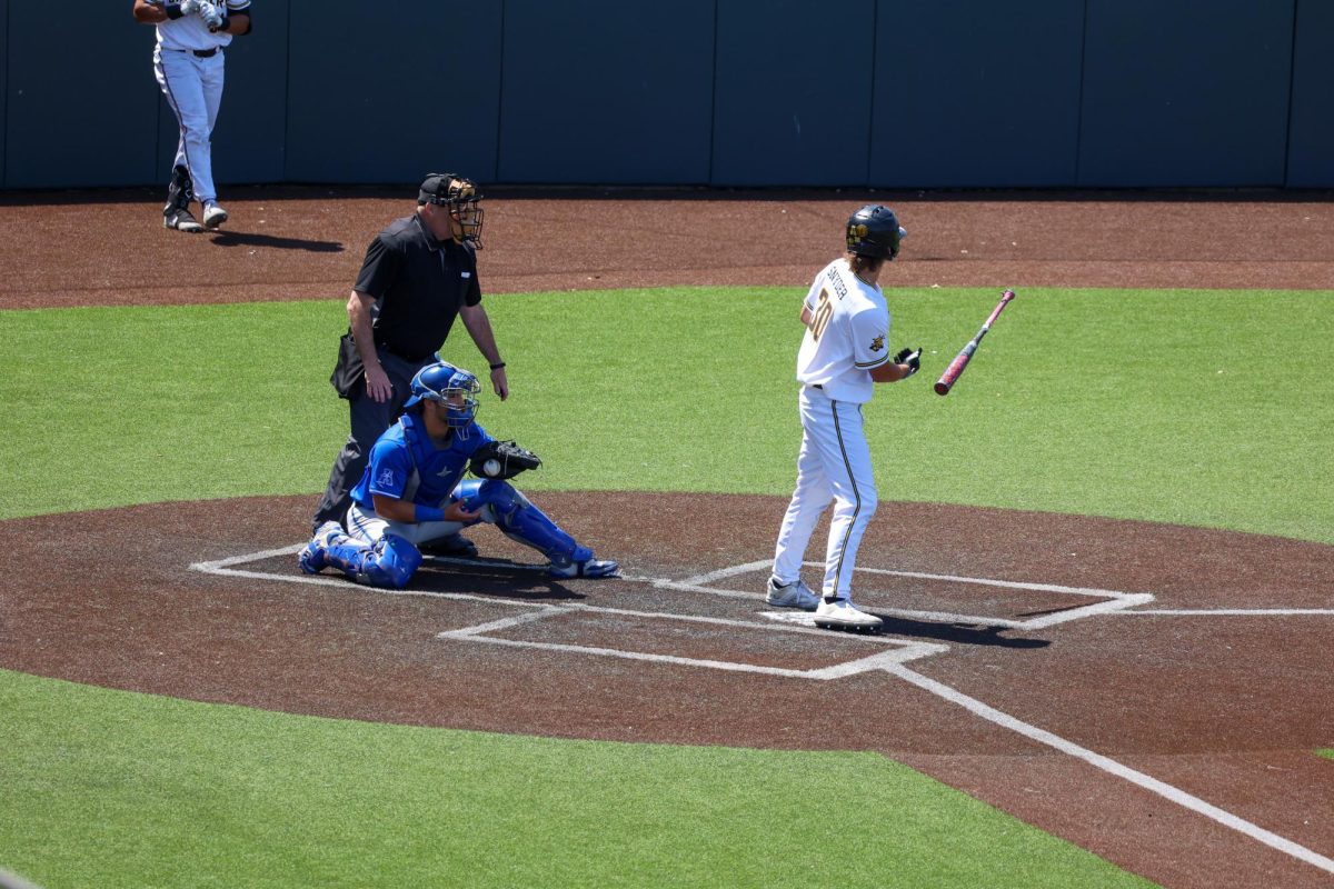 Sophomore Gannon Snyder flips his bat after being walked against Memphis. The Shockers were walked seven times in the 3-1 win on May 17.