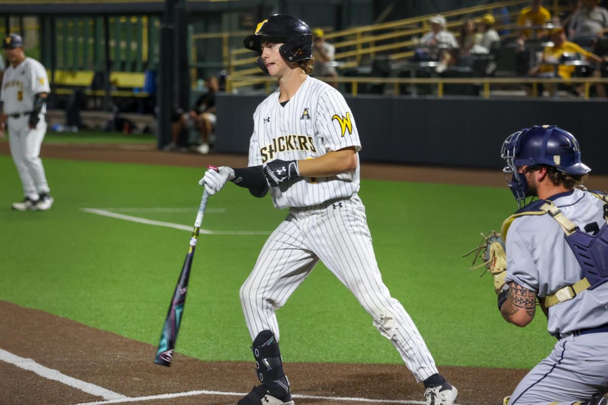 Sophomore Zeb Henry flips his bat after being walked on May 13. Henry was walked a season-high three times in the 13-9 win against Oral Roberts.