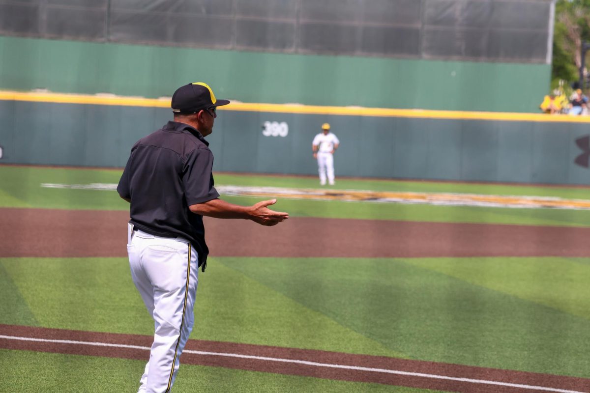 WSU head coach Brian Green asks for an explanation over a call made on May 17. The Shockers won, 3-1, against Memphis on senior day.