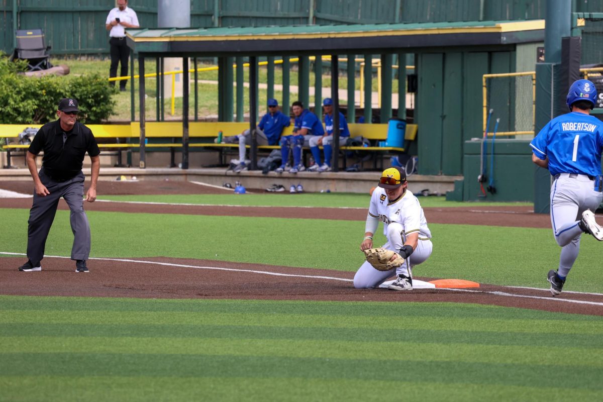 Senior Josh Livingston snags the final out on May 17. The Shockers won their fifth-straight game, 3-1, against Memphis to end the regular season.