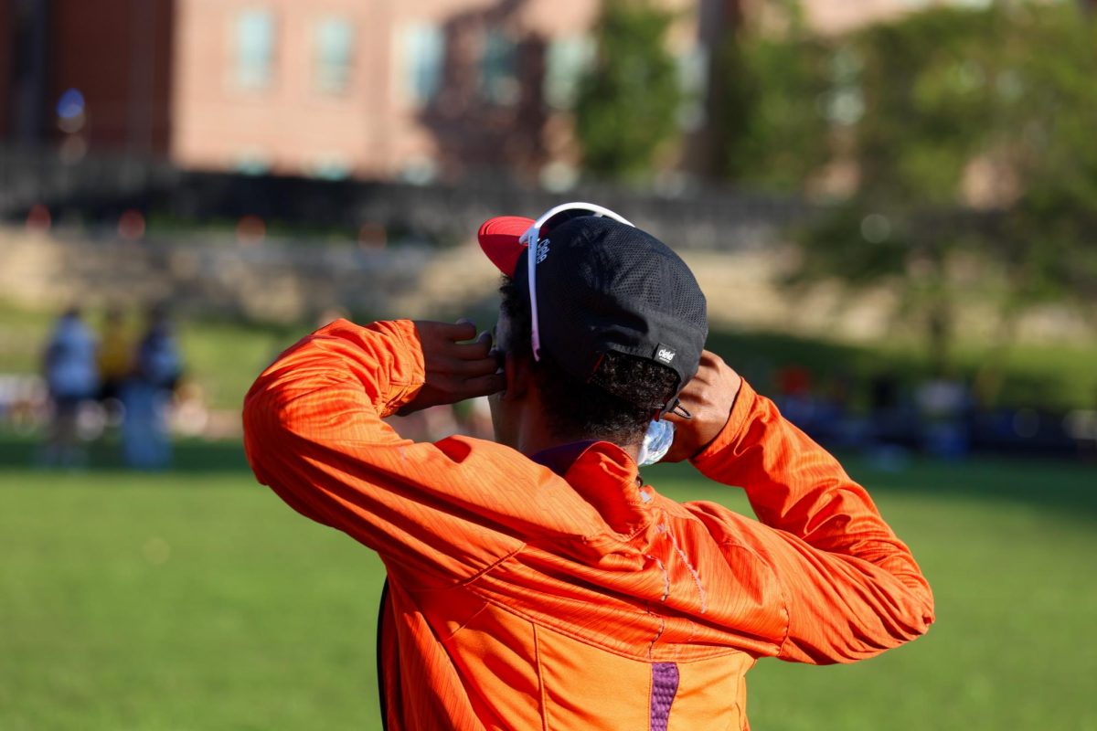 Sophomore Yared Kidane covers his ears before the starting gun goes off. WSU competed in the Shocker Open on May 9, which was the team's last outdoor home meet this season.