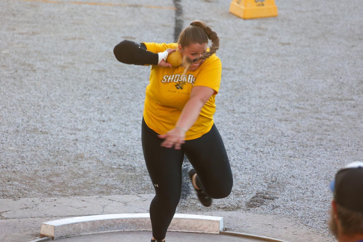 Senior Kylie Zimmer sets up to throw the shot put on May 9. Zimmer placed first at the Shocker Open with a mark of 13.77 meters.