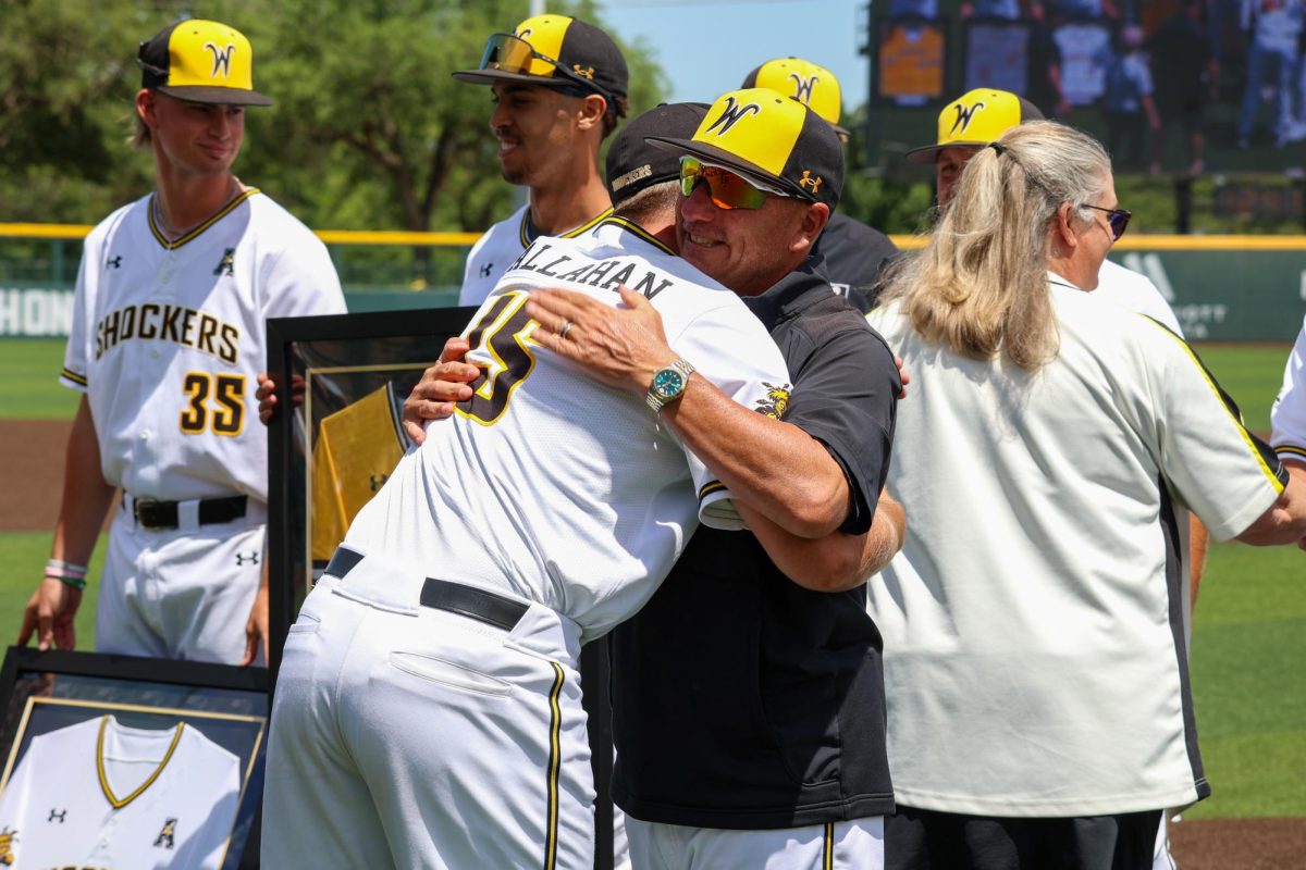 Senior Ryan Callahan hugs WSU head coach Brian Green during the senior day celebration on May 17. Callahan has hit .257 in his two seasons as a Shocker.